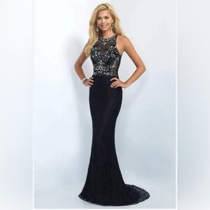 Beautiful gown jewels on top with lace bottom and train.